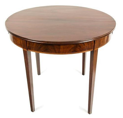 A Hepplewhite Mahogany Flip-Top Table Height 28 3/4 x width 36 x depth 18 inches.