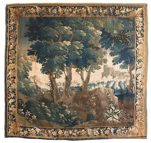 A Flemish Silk and Wool Verdure Tapestry 9 feet 10 inches x 7 feet 5 inches.