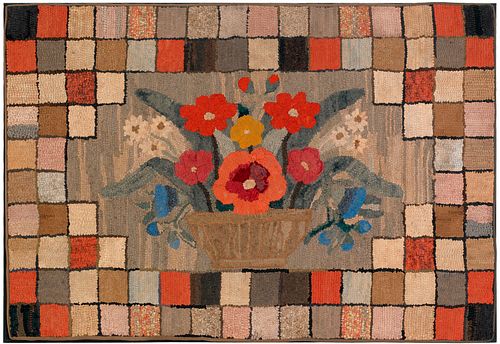 Large American hooked rug, 19th c., with a basketf