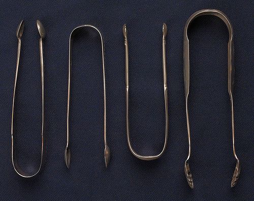 Collection of silver tongs to include sugar tongsy