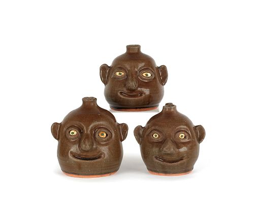 Three Georgia stoneware face jugs by Reggie Meader