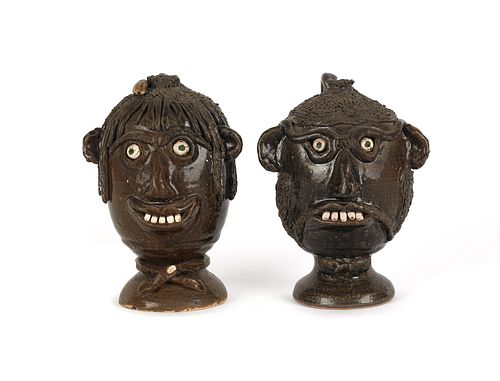 Two Georgia stoneware face jugs by Flossie Meaders