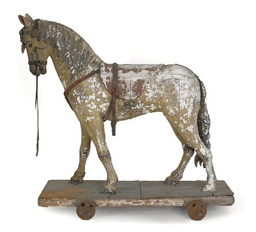 Carved and painted riding horse, 19th c., on a whe