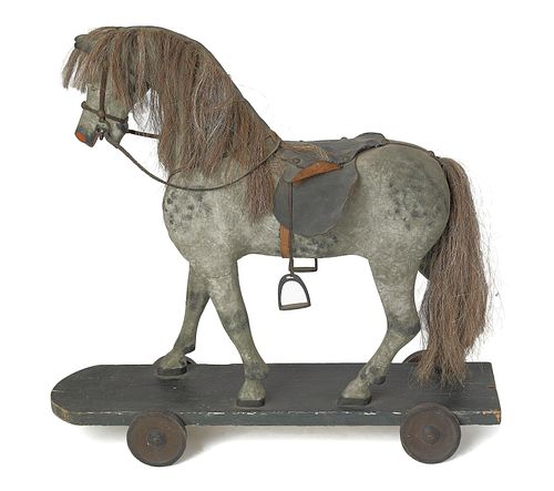 Carved and painted horse riding toy, 19th c., 23".
