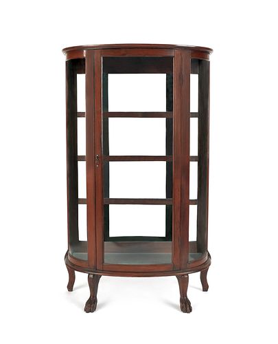 Oak bowfront china cabinet, ca. 1900, by the New F
