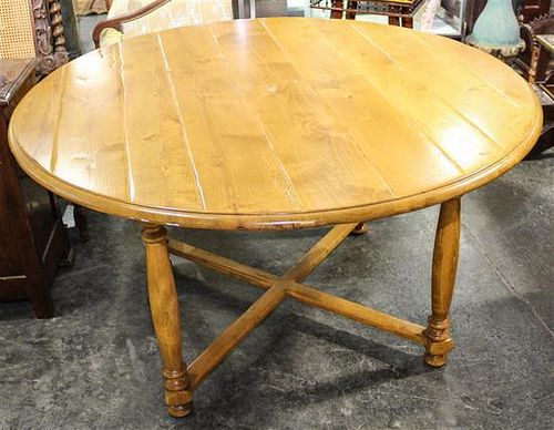 A Provincial Pine Dining Table Height 30 x diameter 55 inches.