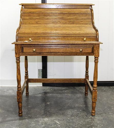 * A Roll Top Desk. Height 44 1/2 x width 32 1/2 x depth 24 inches.