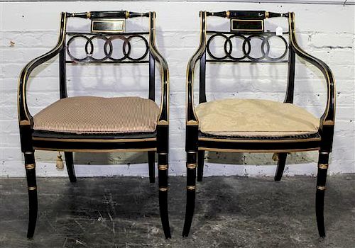 A Pair of Regency Style Parcel Gilt Ebonized Dining Armchairs Height 32 1/2 inches.