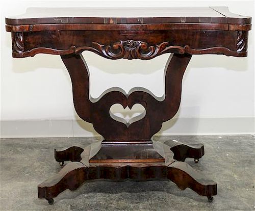 An American Empire Mahogany Game Table Height 29 x width 35 1/4 x depth 18 1/2 inches (closed).