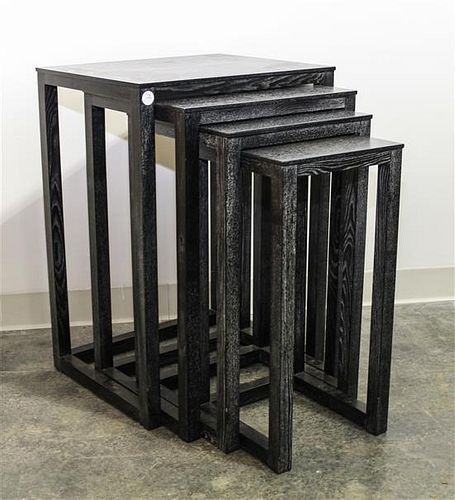 A Set of Four Black Cerused Wood Nesting Tables. Height 27 1/2 inches.