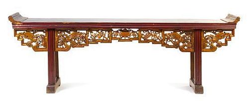 A Gilt and Red Lacquered Elmwood Altar Table Height 37 1/2 x width 109 1/2 x depth 18 1/2 inches.