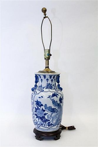 A Blue and White Porcelain Lamp. Height overall 31 1/2 inches.