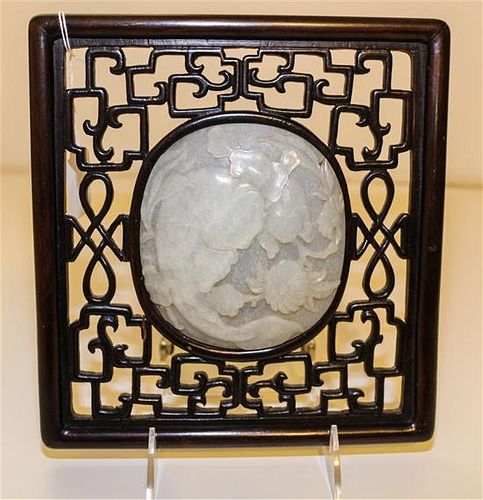A Chinese White Jade Inset Rosewood Panel. Height overall 8 3/4 x width 8 1/2 inches.