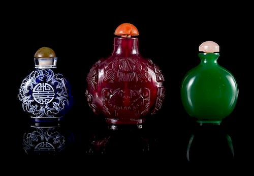 Three Glass Snuff Bottles Height of tallest 3 inches.