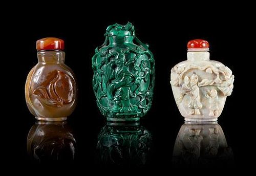 Three Carved Hardstone Snuff Bottles Height of tallest 2 3/4 inches.