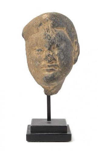 * A Gandharan Greystone Head of a Male Height 2 3/4 inches.