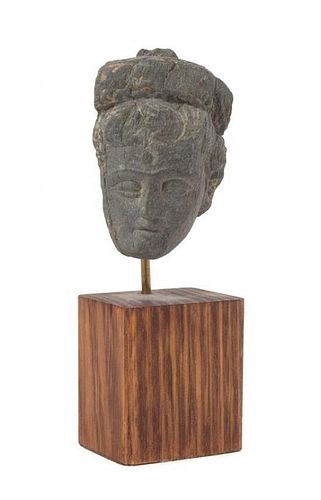 * A Gandharan Gray Schist Head of a Male Height 2 3/4 inches.