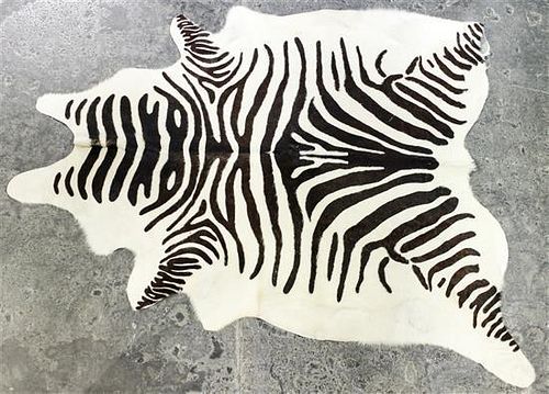 * A Faux Zebra Rug 7 feet 3 inches x 5 feet 7 inches.