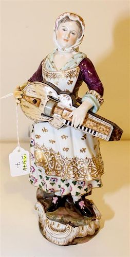 * A German Porcelain Figure Height 12 1/4 inches.