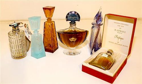 Four Baccarat Glass Perfume Bottles Height of tallest 6 7/8 inches.