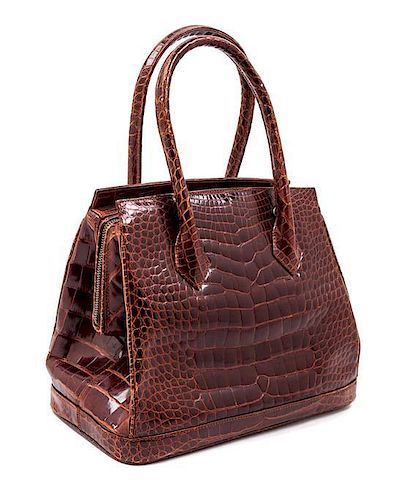 * A Gianni Versace Brown Crocodile Skin Handbag, 11" x 9" x 6".