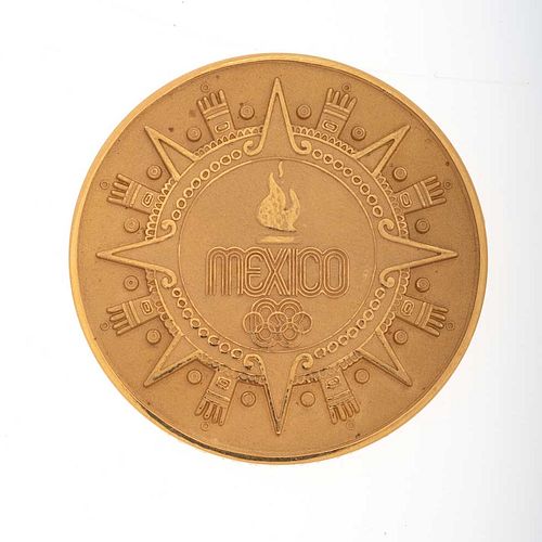 Medalla MÉXICO 1968 en oro amarillo de 21k.  Peso: 41.7g
