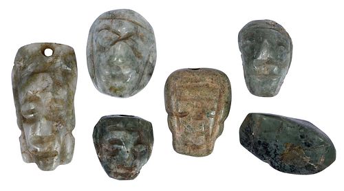 Six Small Mesoamerican Carved Jade Mask Pendants