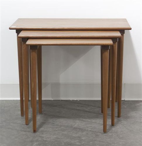 A Set of Three Norwegian Simulated Rosewood or Birch Nesting Tables, Height 19 1/4 x width 24 3/4 inches.