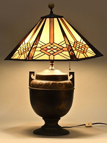 An early 20th century bronze finish lamp with slag shade by The Charles Parker Co.