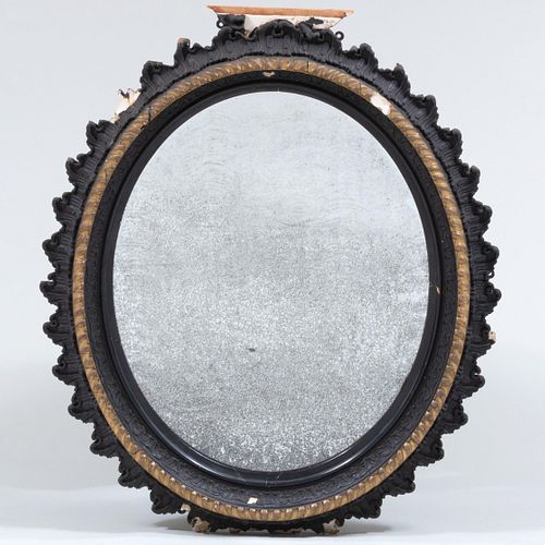 Victorian Ebonized and Giltwood Oval Mirror