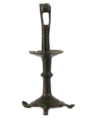 EARLY TRIPOD-BASED COPPER ALLOY CANDLESTICK