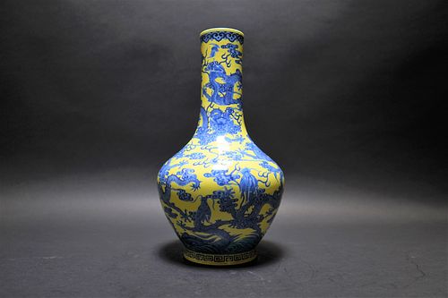 A CHINESE YELLOW GROUND BLUE AND WHITE DRAGON VASE, WITH SIX-CHARACTER 'QIANLONG' MARK