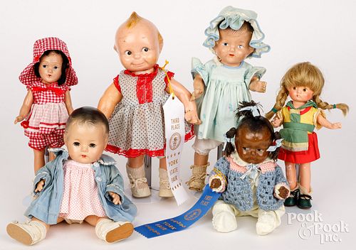 Six composition dolls