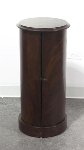 A Regency Style Mahogany Pedestal Cabinet, Height 30 1/4 x diameter 14 3/8 inches.