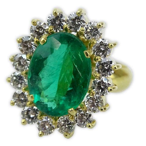 Oval Cut Brazilian Emerald, Approx. 4.15 Carat Round Brilliant Cut Diamond and 18 Karat Yellow Gold Ring.