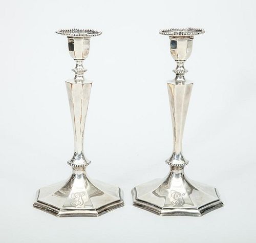 Pair of Theodore B. Starr Monogrammed Silver Weighted Candlesticks