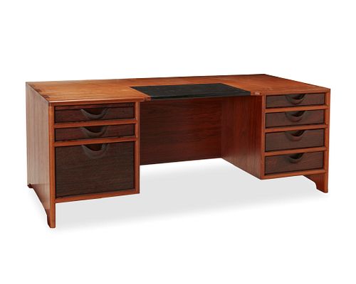 John Nyquist (1936-2018), A teak and rosewood desk, circa 1976, 28" H x 72" W x 33.25" D