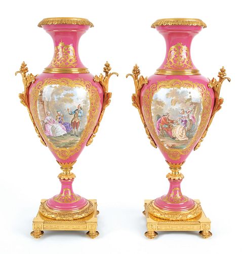 Pair of Serves type ormolu mounted porcelain urnsi