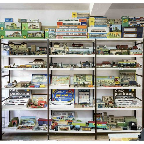 Three shelves with model railwa