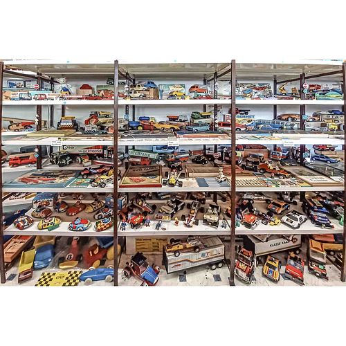 Three shelves with GDR toys aro