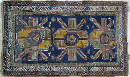 Kazak carpet, early 20th c., with three medallions