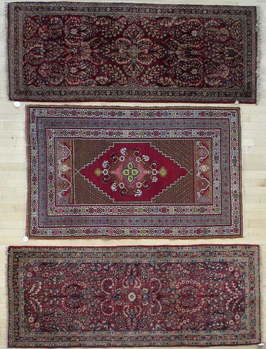 Two Sarouk carpets, 6' 7" x 2' 7"; together with a