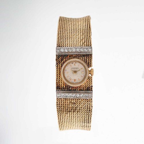 Reloj Longines vintage con 18 diamantes corte 8 x 8. Movimiento de cuerda manual. Caja circular de 15 mm en oro amarillo de 18k....