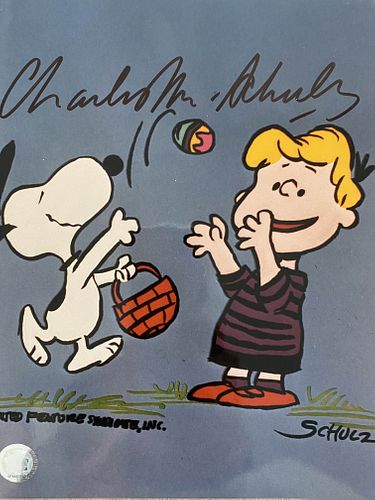 Peanuts Charles Schulz signed photo. GFA Authenticated