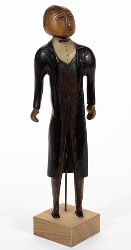CHARLES HENRY SAUNDERS (SHELBY, NORTH CAROLINA, 1901-1984) FOLK ART CARVED AND PAINTED FIGURE OF AN AFRICAN-AMERICAN BUTLER