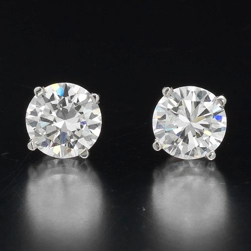 A Pair of 1.08 and 1.11 Carat Diamond Stud Earrings 
