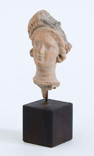 GREEK TERRACOTTA HEAD OF A WOMAN, HELLENISTIC