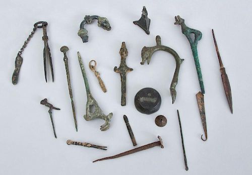 MISCELLANEOUS GROUP OF ANCIENT BRONZE FIBULAE AND METAL FRAGMENTS