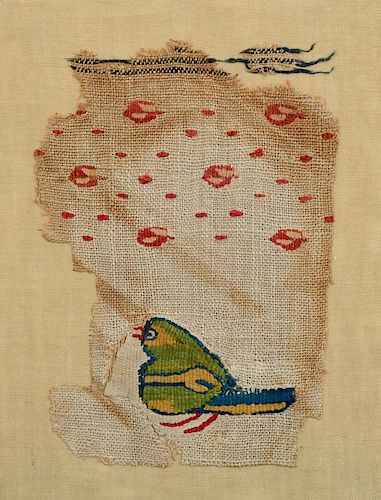 COPTIC TEXTILE FRAGMENT WITH A GREEN BIRD AND ROSE LATTICE