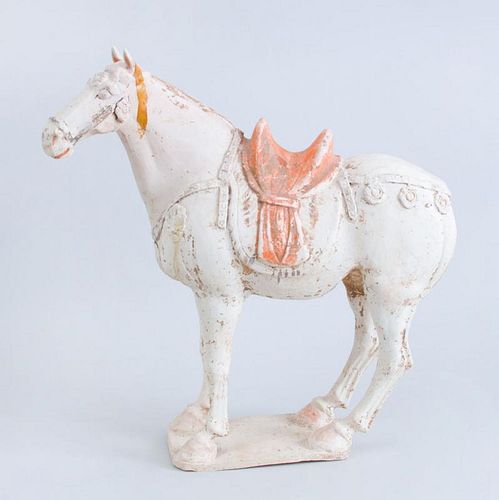 TANG UNGLAZED PAINTED POTTERY FIGURE OF A SADDLED HORSE